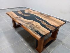 a wooden table sitting on top of a tiled floor