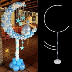 the balloon arch is decorated with stars and moon balloons