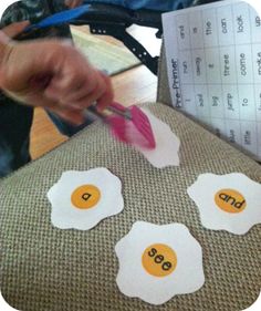 a person cutting out eggs on top of a piece of paper with the words funky fresh frittes