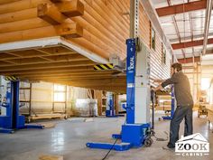 a man working on a machine in a warehouse