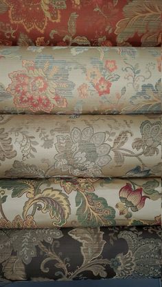 an assortment of different colored and patterned fabrics