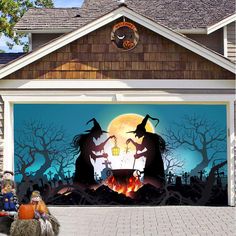 a garage decorated for halloween with pumpkins and witches