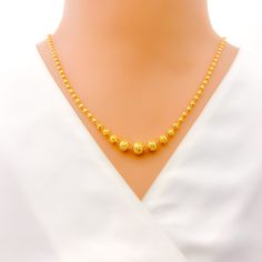 This exquisite 22k gold Lara necklace set, weighing 18.6 grams, features a radiant yellow gold finish and a captivating disco orb design. The necklace measures 20 inches in length, with adjustable 0.6-inch links for a perfect fit. The set includes matching earrings, each 1.5 inches long with screw back posts and detachable hanging elements. Secured with a hook lock, this set is ideal for those who appreciate unique and dazzling jewelry, combining timeless beauty with a twinkling motif, making it 22k Gold Round Beads Yellow Necklace, 22k Gold Yellow Necklace With Round Pendant, Yellow 22k Gold Necklaces With Round Beads, 22k Yellow Gold Round Beads Necklace, Yellow 22k Gold Necklace With Round Pendant, Yellow 22k Gold Necklace With Round Beads, Yellow 22k Gold Round Necklace, Festive Yellow Round Necklace, 22k Gold Chain Necklace