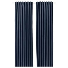 two dark blue curtains hanging on a white wall