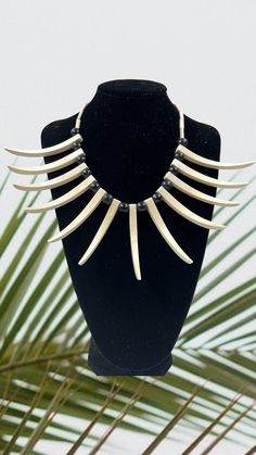 Ula Nifo necklace. Dancing necklace for Samoan siva. It is used by both males and females. These are "ALL" woods. Black beads and white spikes are woods.  Large necklace is about 20"by 6" spikes. Ancient days this necklace was made from wild boar tusks but it is rare now. There are two options. Option 1 requires you to buy as many necklaces for a price of $25 each. The second option encourages you to buy 10 pieces for a discount of $25. We always run out of this original necklaces so the faster you buy then you have less regrets 😊 We ship these items from Hawaii. thank you White Spikes, Tusk Necklace, Blue Avatar, Dance Necklace, Original Necklace, Second Option, Large Necklace, Wild Boar, Black Beads