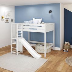 a child's bedroom with a slide and bunk bed in the corner, blue walls