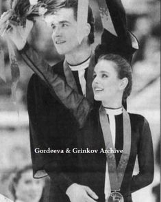 a man and woman standing next to each other