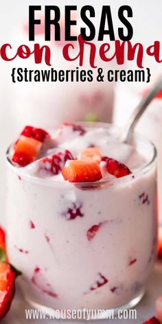 strawberry cheesecake parfait in a glass bowl with strawberries and cream