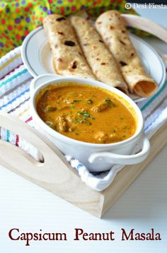 a bowl of soup and two pita breads on a tray with the caption capsicum peanut masala