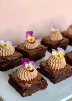 there are many brownies with flowers on them