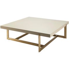 a white coffee table with gold legs on a white background