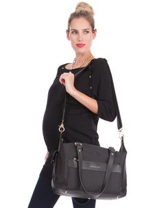 a pregnant woman carrying a black handbag