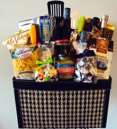 a basket filled with lots of food and condiments