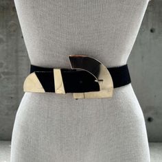 80s black suede belt, chunky geometric gold tone buckle, mirror effect buckle, sophisticated style, maximalist fashion, stage accessories Step into the spotlight with this striking 1980s black suede belt, a true statement piece for the discerning fashionista. Crafted with an eye for elegance and drama, this belt is the epitome of sophisticated maximalist fashion, making it an ideal accessory for those who love to make a bold impression. The rich black suede provides a sumptuous texture, perfectly complementing the belt's luxurious design. The belt features a chunky geometric buckle in a radiant gold tone, designed to catch the light and captivate the eye. This buckle is not just a fastening mechanism but a central focal point, with its mirror effect creating an interplay of reflections tha Sophisticated Maximalist, Stage Accessories, Fashion Stage, Maximalist Fashion, Mirror Effect, Suede Belt, Luxurious Design, Suspender Belt, Sophisticated Style