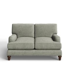 a gray couch sitting on top of a white floor