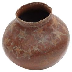 a brown vase is shown on a white background