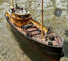 an old fashioned boat floating in the water