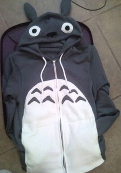 a black and white hoodie with eyes on it