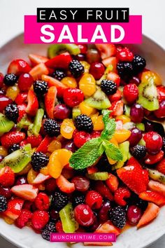 a white bowl filled with fruit salad on top of a table