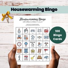 someone holding up a printable housewarming game