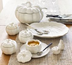 white pumpkins and dishes on a table