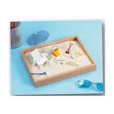 Imagine taking that long overdue vacation to a tropical resort where the surf gently caresses the white sand beach. Dream no more. Bring the beach to your home or office with this executive sandbox and enjoy the peace and serenity year round. You can almost hear the waves now. Includes 9.75" x 7.75" x 1.25" hardwood sandbox, pearl white sand, 1 sand pail, 1 grooming rake, 1 digging shovel, mini sea shells, 1 starfish, 1 sun umbrella with stand, 1 beach chair, and 1 sandcastle. Sand Tray, Cubicle Decor, Tropical Resort, A Day At The Beach, Coastal Living Room, Sun Umbrella, Beach Chair, Day At The Beach, Sandbox