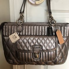 Coach Silver Leather Quilted Bag-Brand New With Tag Still On It. Retails For $358 In Macy’s. Light Blue Interiors With No Marks. Also Comes With Protector Bag Too. Designer Silver Bags For Office, Designer Silver Shoulder Bag For Office, Designer Silver Shoulder Bag, Luxury Coach Shoulder Bag With Silver-tone Hardware, Coach Zip Top Tote, Blue Interiors, Gold Tote Bag, Grey Tote Bags, Brown Leather Tote Bag