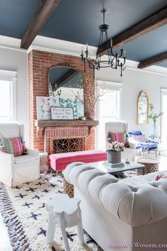 a living room filled with furniture and a fire place