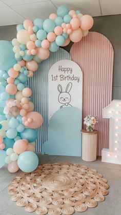 Adorable bunny-themed first birthday setup with pastel balloon garland, a "Happy 1st Birthday" sign featuring a bunny illustration, and soft pink and blue decor, creating a sweet and inviting atmosphere. 1st Birthday Theme, Party Ideas For Girls, First Birthday Party Ideas, 1st Birthday Themes, First Birthday Themes, Happy 1st Birthdays, Birthday Themes, Balloon Decor, Girl First Birthday