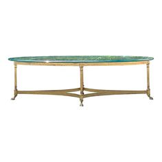 a table with a green marble top and gold metal legs on an isolated white background