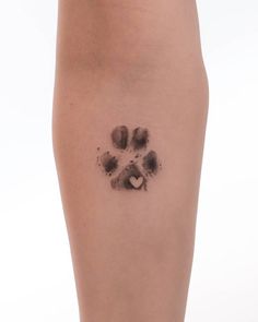 an animal paw print on the side of a woman's leg