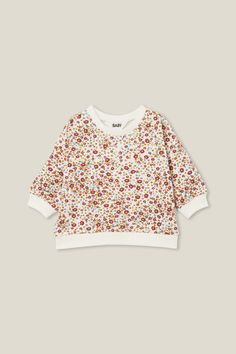 ALMA DROP SHOULDER SWEATER Winter Floral Print Cotton Tops, White Long Sleeve Sweatshirt With All Over Print, White Cotton Top With Ditsy Floral Print, Fall Long Sleeve Printed Sweatshirt, Cream Long Sleeve Sweater With Floral Print, White Tops With All Over Print For Fall, Fall Cotton Sweater With Floral Print, Fall Cotton Sweatshirt With All Over Print, Fall Cotton Floral Print Sweater