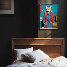 a bed with white pillows and a painting on the wall above it that has a cat in a red coat