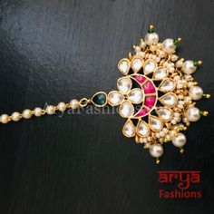 Sabyasachi Mang Tika/ Kundan Maang Tika/ Rajwadi Bollywood Mang Tika/ Bridal Mang Tika/ Ruby Mang Tika/ Punjabi TikkaMade in Brass with Kundan, Pearls and Emerald/Ruby stonesLightweight JewelryPendant: 1.5"Total Length: 5"Mang Tika comes with Hook to attach to hairSuitable for any traditional attire/ OccasionMade with very high quality pearls Pink Festive Tikka, Festive Kundan Tikka For Rituals, Multicolor Tikka With Zari Work For Festivals, Multicolor Kundan Necklace For Rituals And Festive Occasions, Traditional Meenakari Tikka For Rituals, Bollywood Style Festive Tikka With Motifs, Bollywood Festive Tikka With Motifs, Bollywood Style Festive Tikka For Rituals, Bollywood Style Festive Ritual Tikka