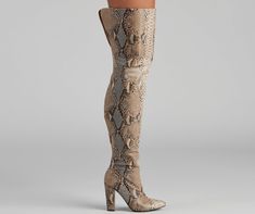 Set the chic standard in boots that elevate your outfit. The boots feature a faux snake print. an inner zipper closure. a pointy toe. block heel. The boots are composed of a faux leather material. Complete look with a cardigan and mini skirt. Fit & Features Faux snake print Thigh-high fit Inner zipper closure Pointy toe Block heel Faux leather material Runs true to size Snake Boots, Occasion Shoes, Rhinestone Dress, Embellished Dress, Boots For Sale, The Chic, Snake Print, Ladies Day, Leather Material