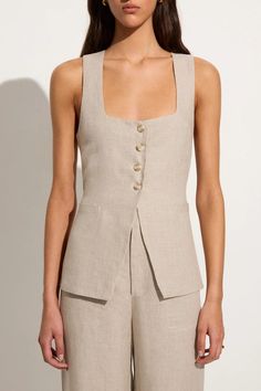 The Maya Vest in Natural offers a feminine and modern take on the classic vest style. Cut from 100% linen fibres in its natural and undyed form, it features a square neckline, four-button front closure, open front hem and a back waist tie for a custom fit. Pair it with the Isotta Pant for a tailored two-piece set. Áo Blu, Vest Style, Linen Fashion, Faithfull The Brand, Linen Style, Vest Fashion, Shop Maxi Dresses, Linen Women, Vest Top