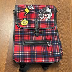 Disney Store Cruella Laptop Backpack Cool Patches Plaid Design Skull Zipper Are Just Some Of The Fine Details On This Fabulous Bag Plaid Isn’t Blue White Red And Yellow Simply Sour Patch Ouch Patch With Lightning Bolt And Cruella Face Patch Brand New No Tags Definitely A Rad Statement Piece Official Disney Cruella Movie Merch Smoke Free Home See Pictures For Measurements Casual Red Satchel For School, Retro School Satchel With Zipper Closure, Retro Satchel With Zipper Closure For School, Red Satchel With Zipper Closure For School, Cruella Movie, Disney Cruella, Face Patches, Sour Patch, Cool Patches