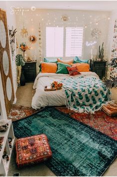 a bed room with a neatly made bed and lots of pillows