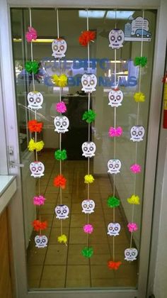 a door decorated with paper flowers and skulls