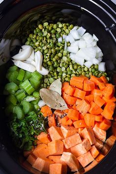 carrots, celery, peas and onions in a slow cooker