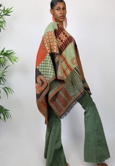 This gorgeous shawl is all about color. It features a beautiful ethnic inspired motif and features beautifully shades of green, orange and brown. One Size Fits All Orange Shawl Scarf For Fall, Orange Shawl Scarves For Fall, Multicolor Bohemian Pashmina Shawl, Multicolor Hippie Shawl One Size, Multicolor One Size Hippie Shawl, Multicolor One-size Hippie Shawl, Hippie Multicolor One-size Shawl, Bohemian Multicolor Wrap For Fall, Bohemian Multicolor Wraps For Fall