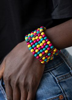 Held together with rectangular wooden fittings, strands of vivacious pink, yellow, and blue wooden beads are threaded along stretchy bands that layer around the wrist into one colorful stretch bracelet.

 Sold as one individual bracelet. Paparazzi Jewelry Images, Bracelets Trendy, Multicolor Bracelet, Wood Bead Bracelet, Wooden Bracelet, Wood Bracelet, Paparazzi Accessories, Paparazzi Jewelry, Yellow And Blue