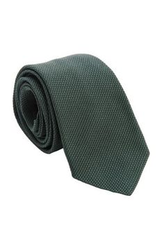 Embrace classic elegance with this forest green grenadine tie that will give your look understated sophistication and will make a lasting impression. Standard Length: Approx. 3.25" x 58.5". A classic tie width and length that is perfect for most men up to 6'2". 100% silk grenadine garza fina: Garza fina (fine gauze) is a loose weave fabric made from high-twist yarns. It has a slightly knobby texture. Tipped with our signature pinstripe silk: Not only is it a refined finishing touch, it keeps you Classic Green Ties For Formal Occasions, Classic Green Formal Tie, Classic Green Ties For Black Tie Occasions, Classic Green Ties For Black Tie Events, Classic Green Tie For Black Tie Occasions, Classic Green Suit And Tie Accessories, Elegant Green Ties For Workwear, Elegant Green Ties For Work, Elegant Green Tie For Work