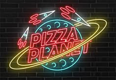 a neon sign that says pizza planet with an image of saturn in the center and stars above it