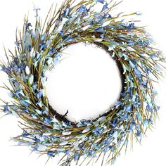 a wreath with blue flowers is shown against a white background