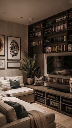 a living room filled with furniture and a flat screen tv mounted to the side of a wall