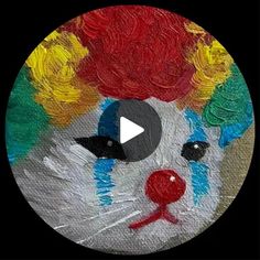 a painting of a clown's face in the middle of a circle with red hair