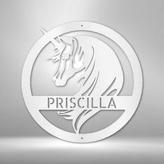 a white circular sign with the word prisculla on it and a horse's head