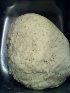 a ball of dough sitting in a bowl