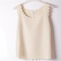 Material: Polyester Tops Type: Tank Tops Gender: Women Pattern Type: Solid Decoration: Tassel Clothing Length: REGULAR Item Type: Tops Style: England Style Fabric Type: Chiffon Spring Sleeveless Chiffon Blouse, Chic Beige Tank Blouse, Chic Sleeveless Beige Blouse, Elegant Sleeveless Chiffon Top, Beige Sleeveless Blouse Camisole For Spring, Spring Chiffon Sleeveless Blouse, Sleeveless Beige Summer Blouse, Tassel Clothing, Tassel Outfit